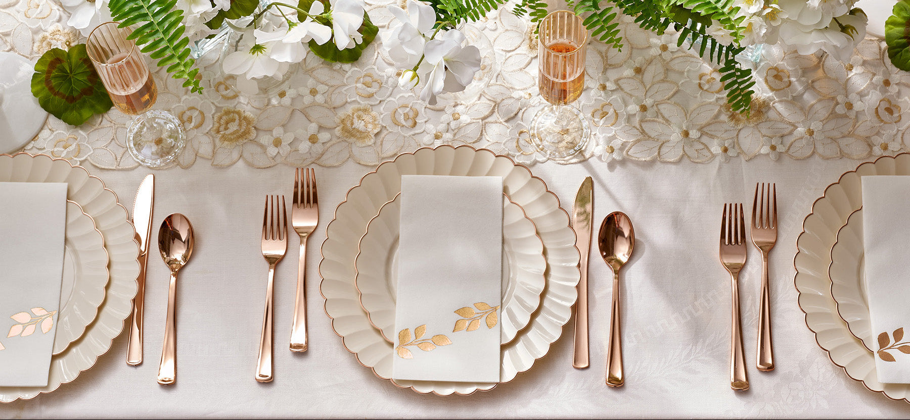 Elegant wedding table setting with scalloped plates
