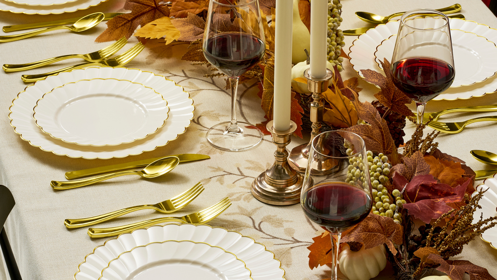 By Madee ivory and gold scalloped dinnerware styled for a Thanksgiving table