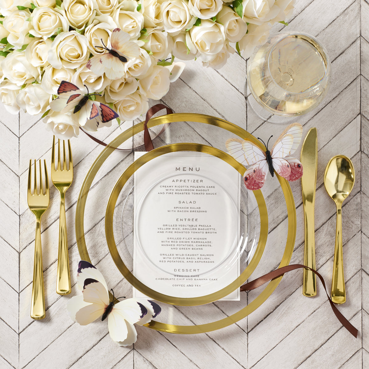 Clear gold disposable dinnerware styled for an elegant celebration